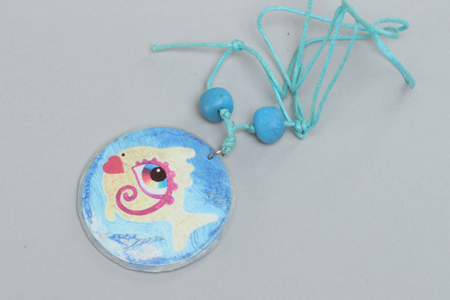 Handmade round shape pendant with blue fish print made of polymer clay photo 2