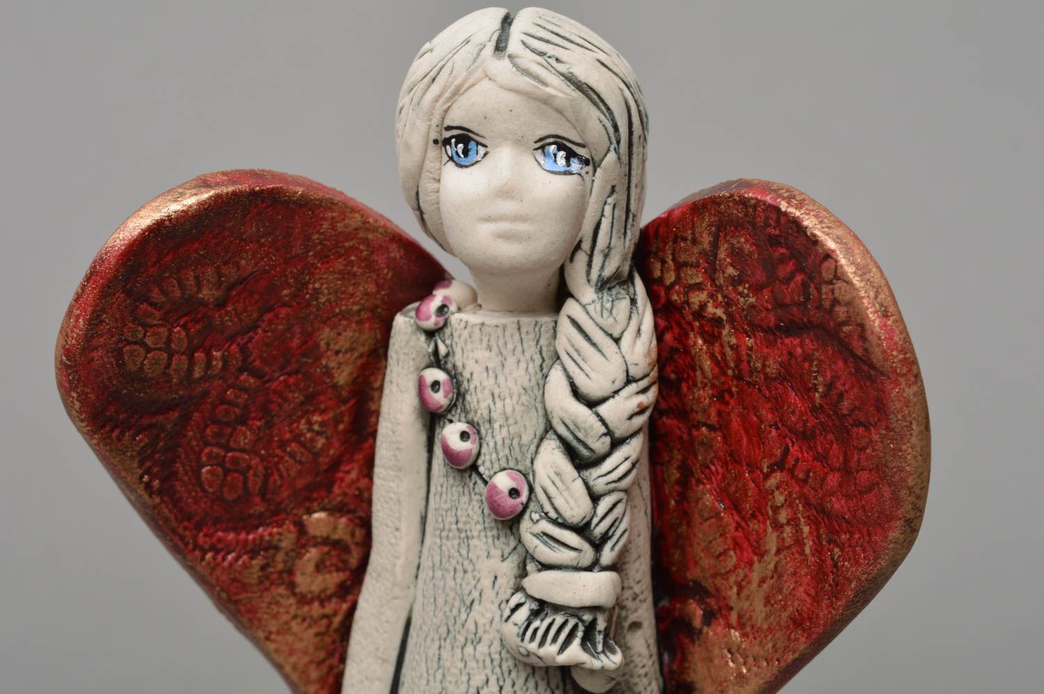 Handmade decorative souvenir statuette made of porcelain Angel with plait photo 2
