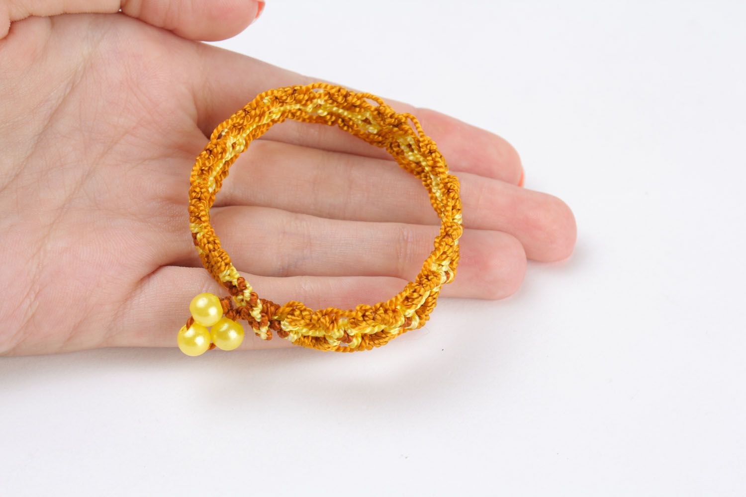 Yellow bracelet made using macrame weaving technique photo 2
