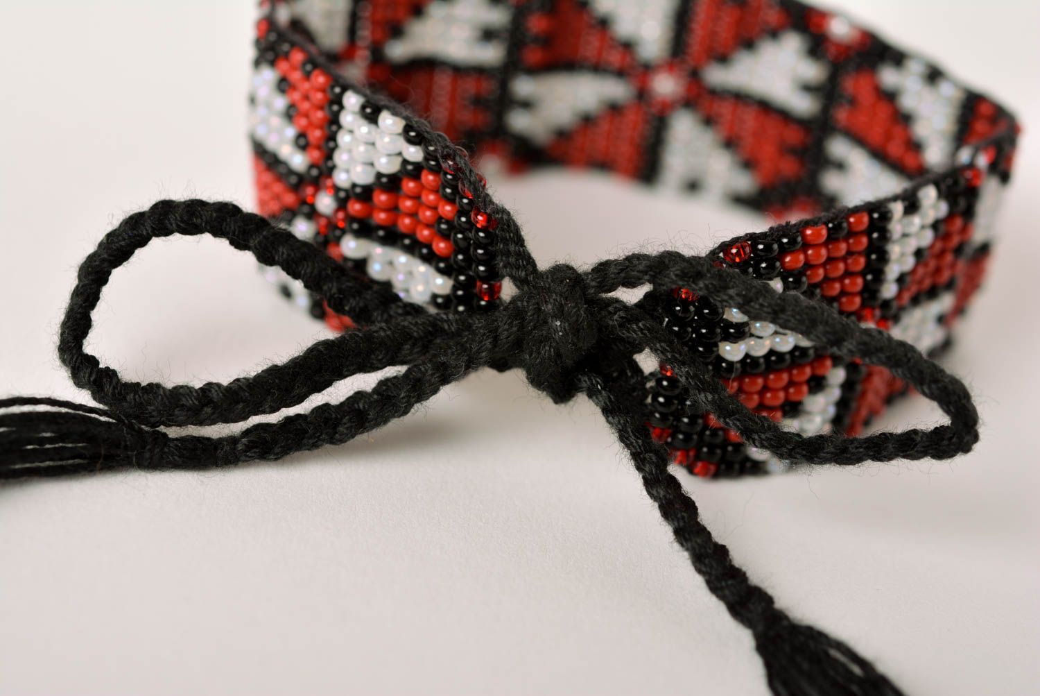 Black cord strand bracelet with geometric ornament for girls photo 3