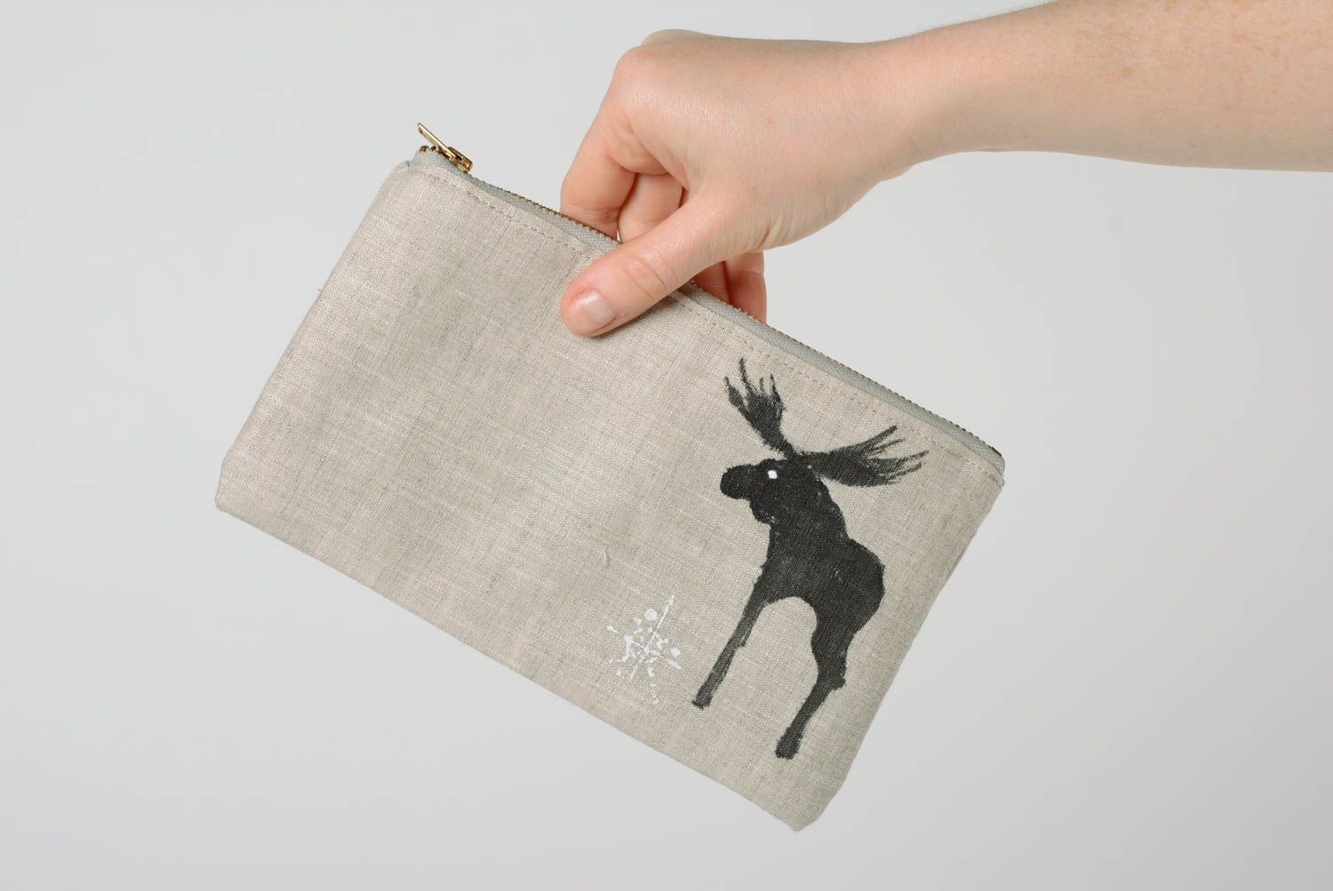 Handmade cosmetic bag sewn of gray linen fabric with zipper and elk image photo 2