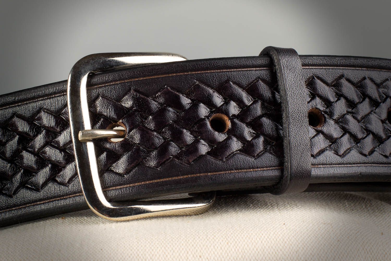 Handmade dark belt made of natural leather with metal buckle and ornament  photo 1