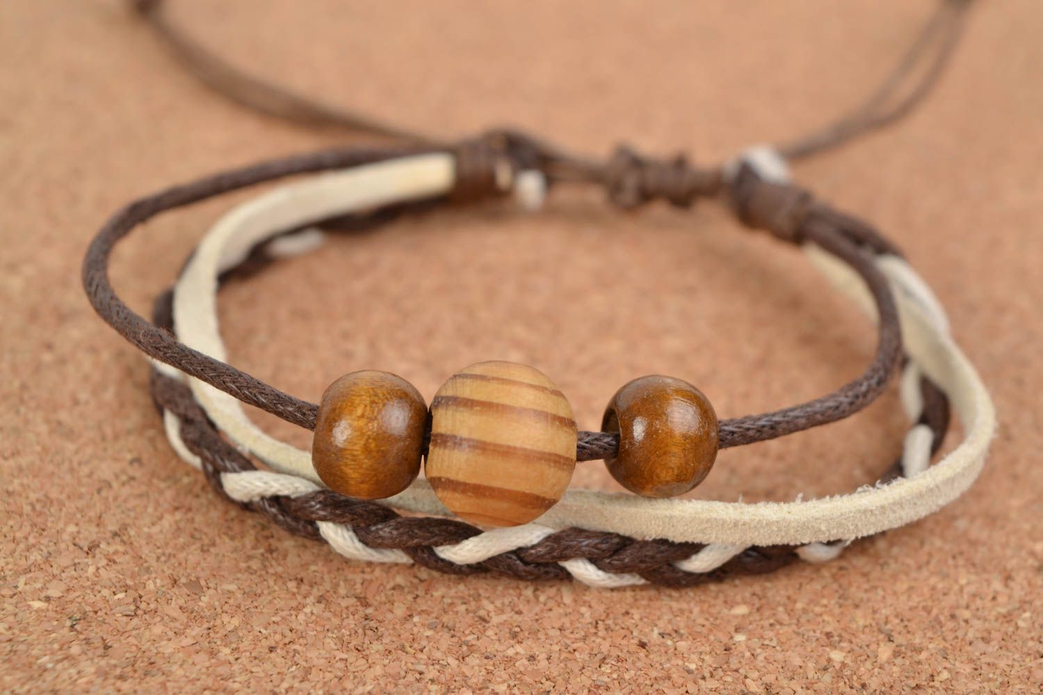 Handmade thin brown suede cord woven wrist bracelet with wooden beads insert photo 1