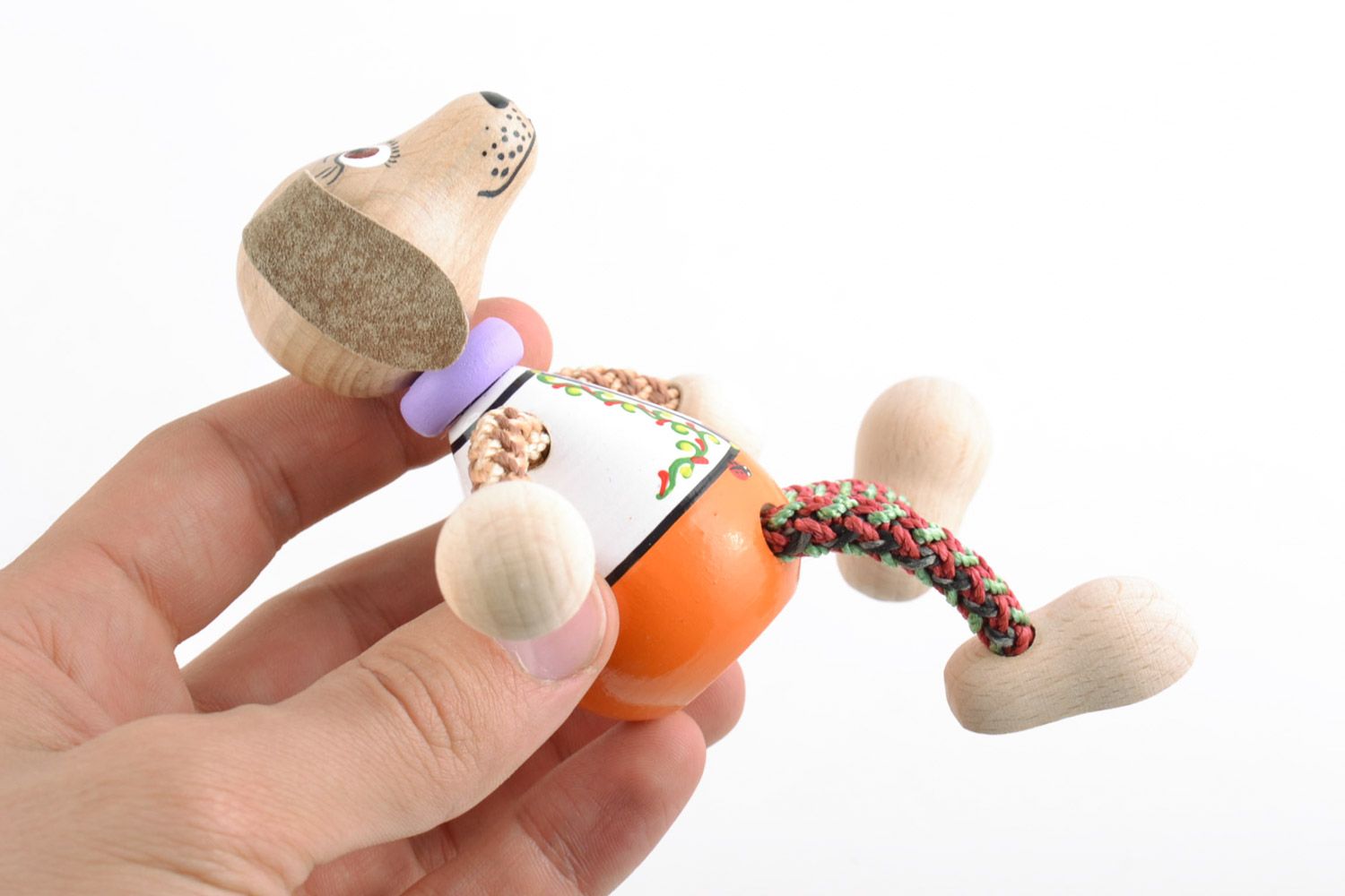 Small homemade wooden eco toy dog painted with natural dyes for children photo 2