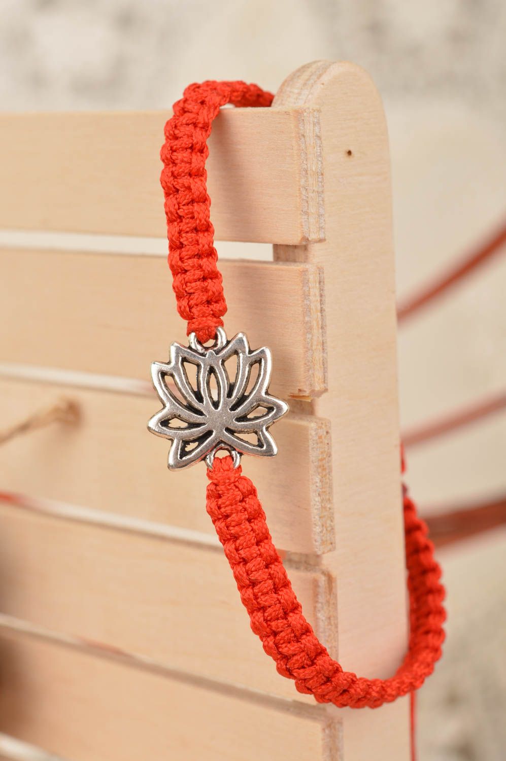 Beautiful handmade red woven silk thread bracelet with metal insert Lotus photo 1