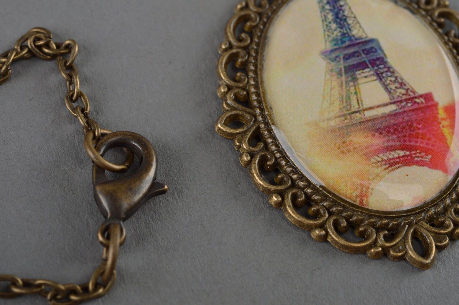 Handmade vintage oval lacy metal pendant with epoxy resin Eiffel Tower on chain photo 3