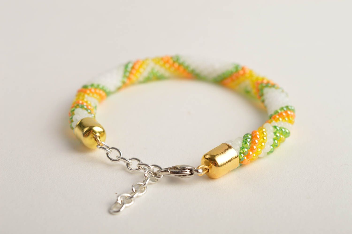 Beaded cord adjustable bracelet in light green, yellow and white color photo 3