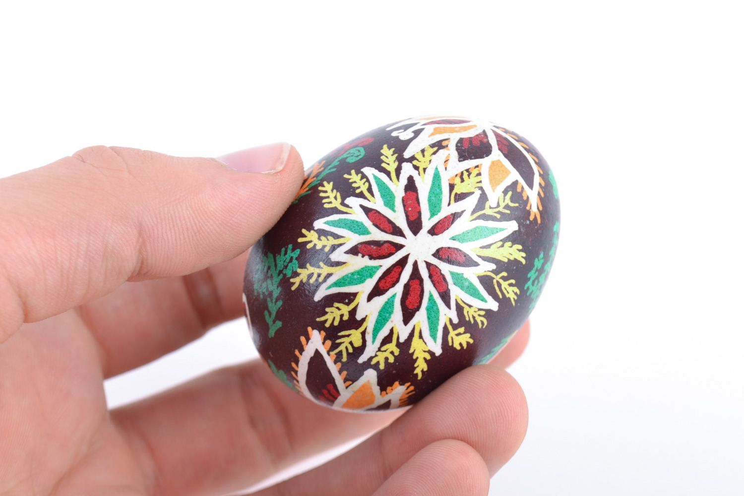 Handmade designer painted Easter egg with floral ornaments on dark background photo 2