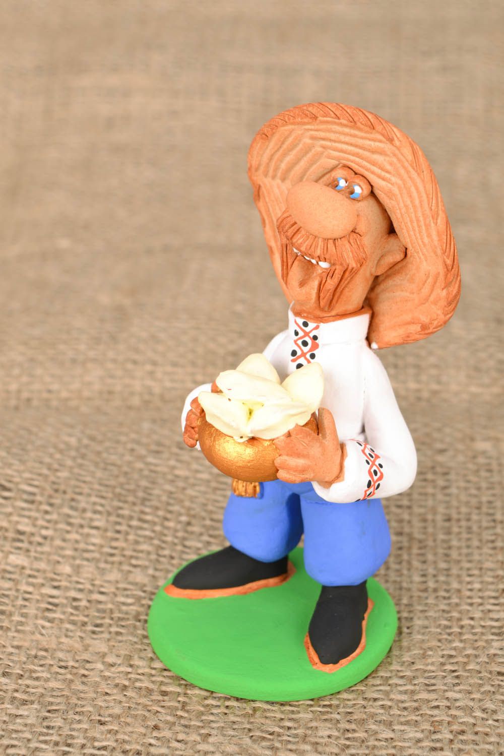 Clay handmade figurine Cossack with dumplings  photo 1