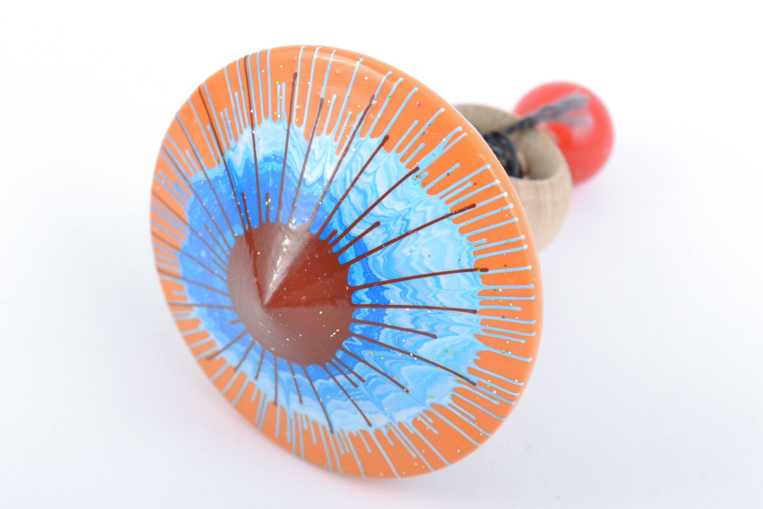 Homemade wooden ornamented toy spinning top painted with eco dyes for children photo 3