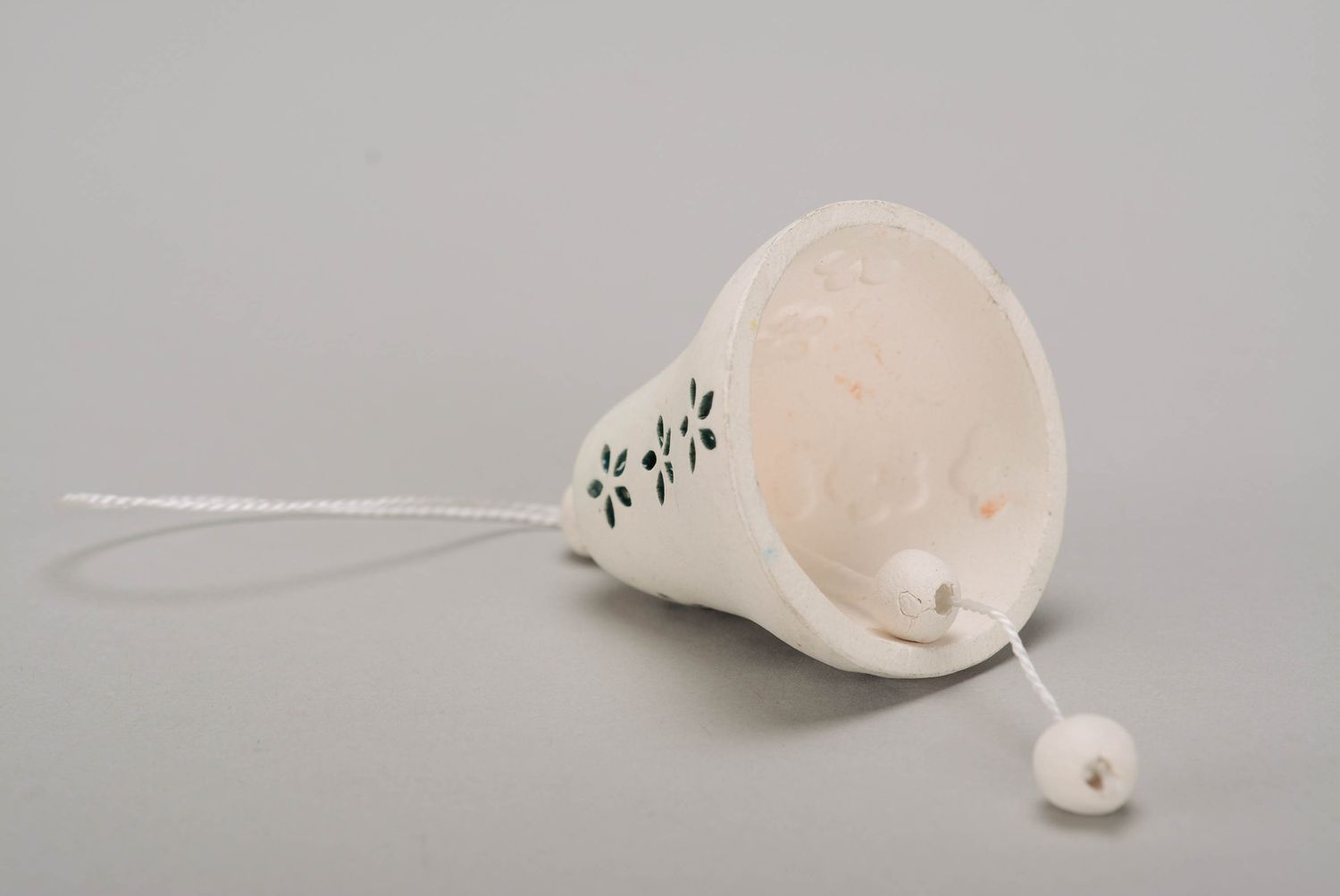 Bell made of white clay photo 3