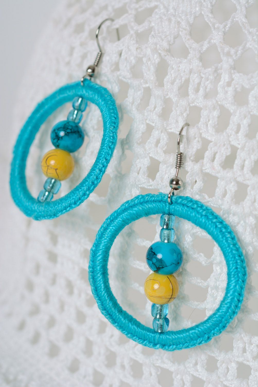 Handmade ring-shaped earrings with beads crocheted over with cotton threads photo 1