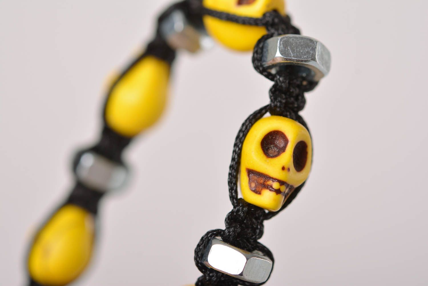 Handmade yellow skull beaded black cord bracelet with female screws photo 5