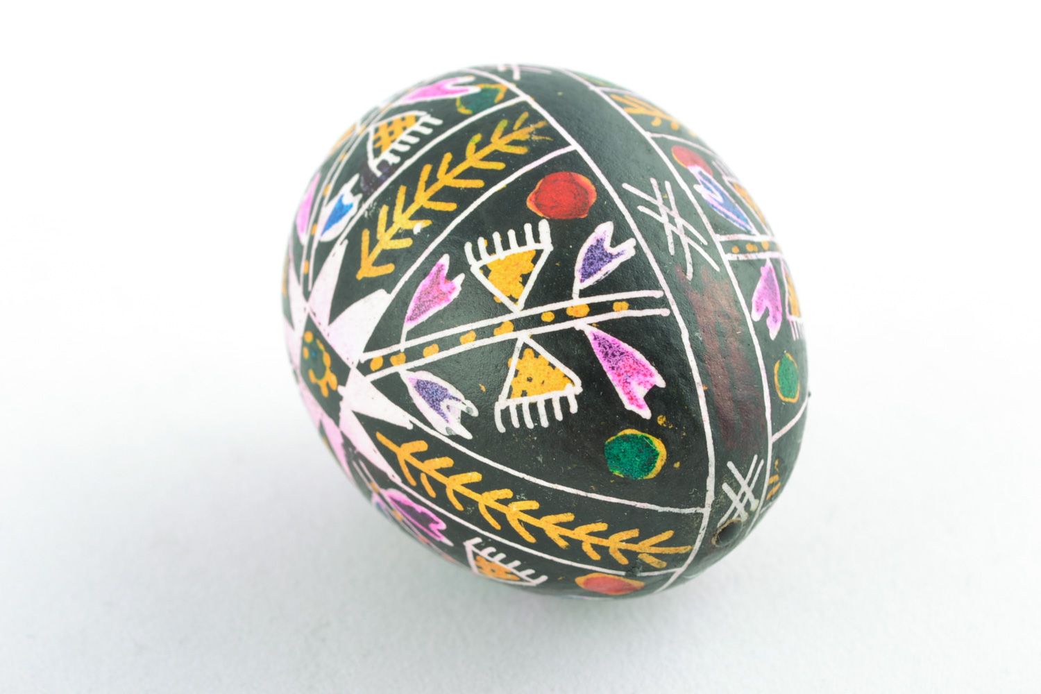 Handmade black Easter egg with rich pattern painted with wax and aniline dyes photo 3