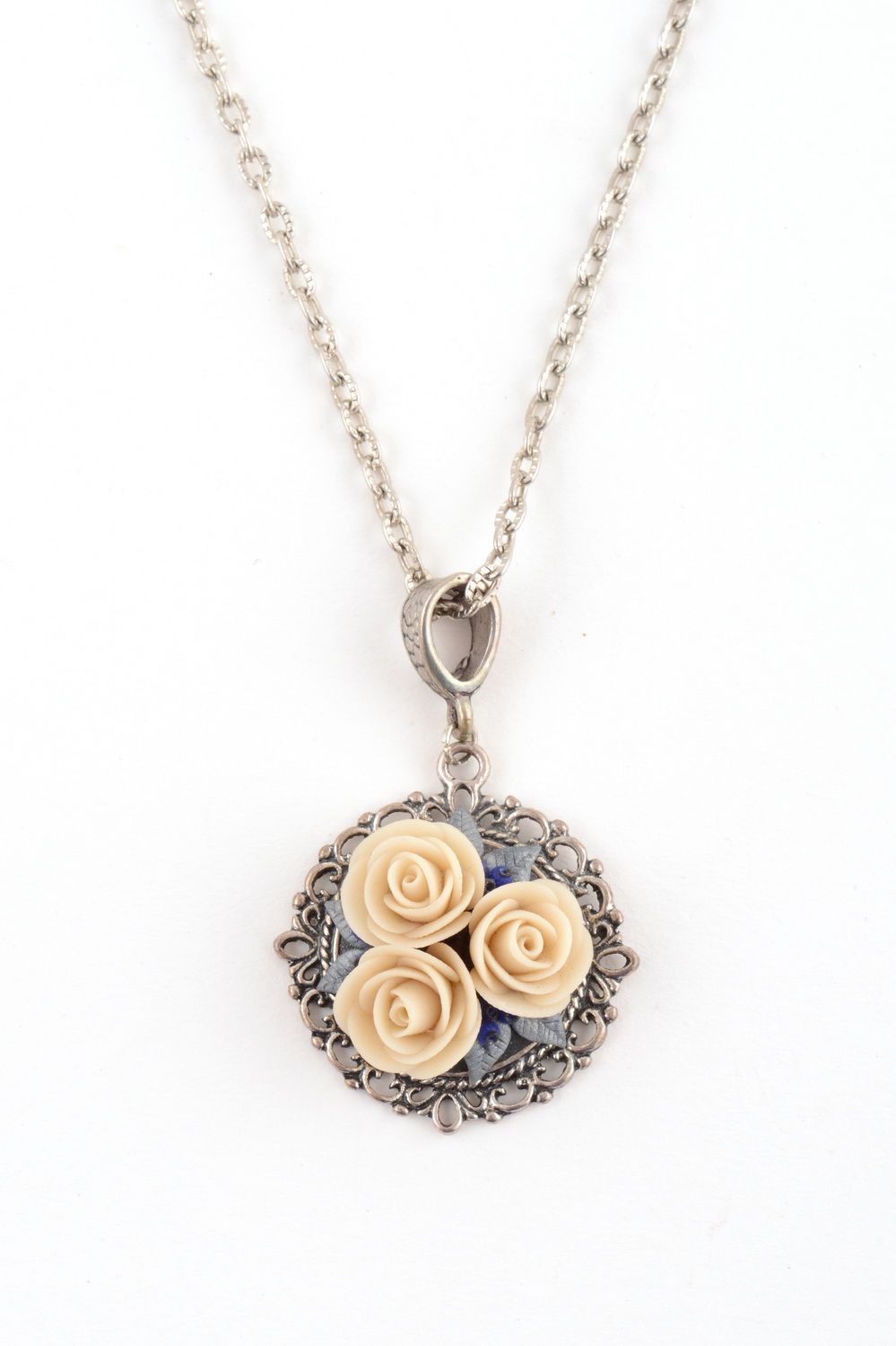 Handmade metal round pendant on chain with polymer clay cream colored flowers photo 2