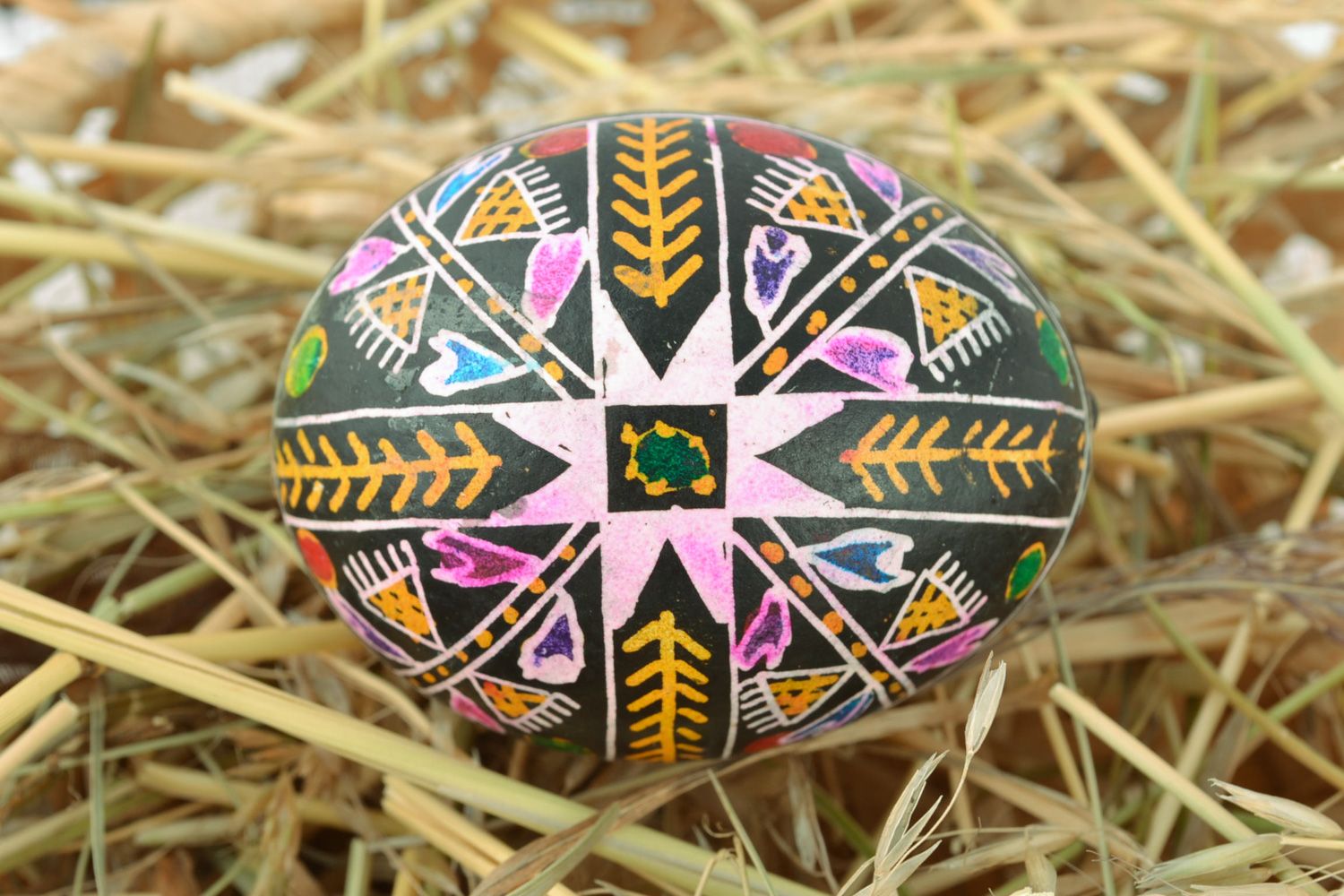 Handmade black Easter egg with rich pattern painted with wax and aniline dyes photo 1