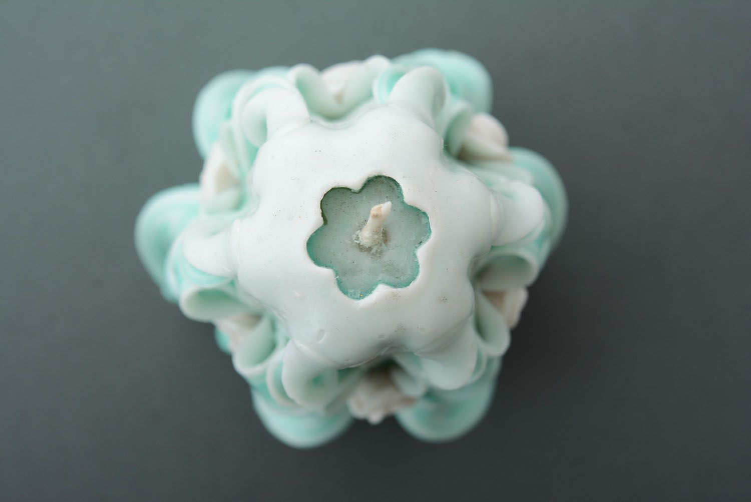 Carved candle of mint color photo 3