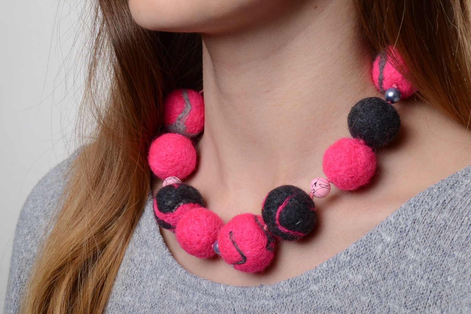 Bright pink and gray handmade wool ball necklace created using needle felting technique photo 1