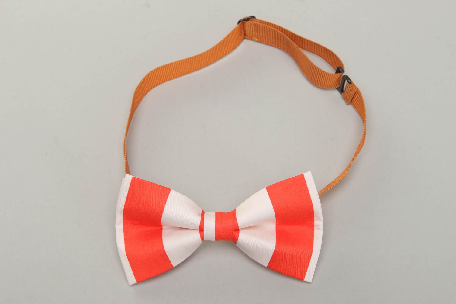 Fabric bow tie of white and red colors photo 1