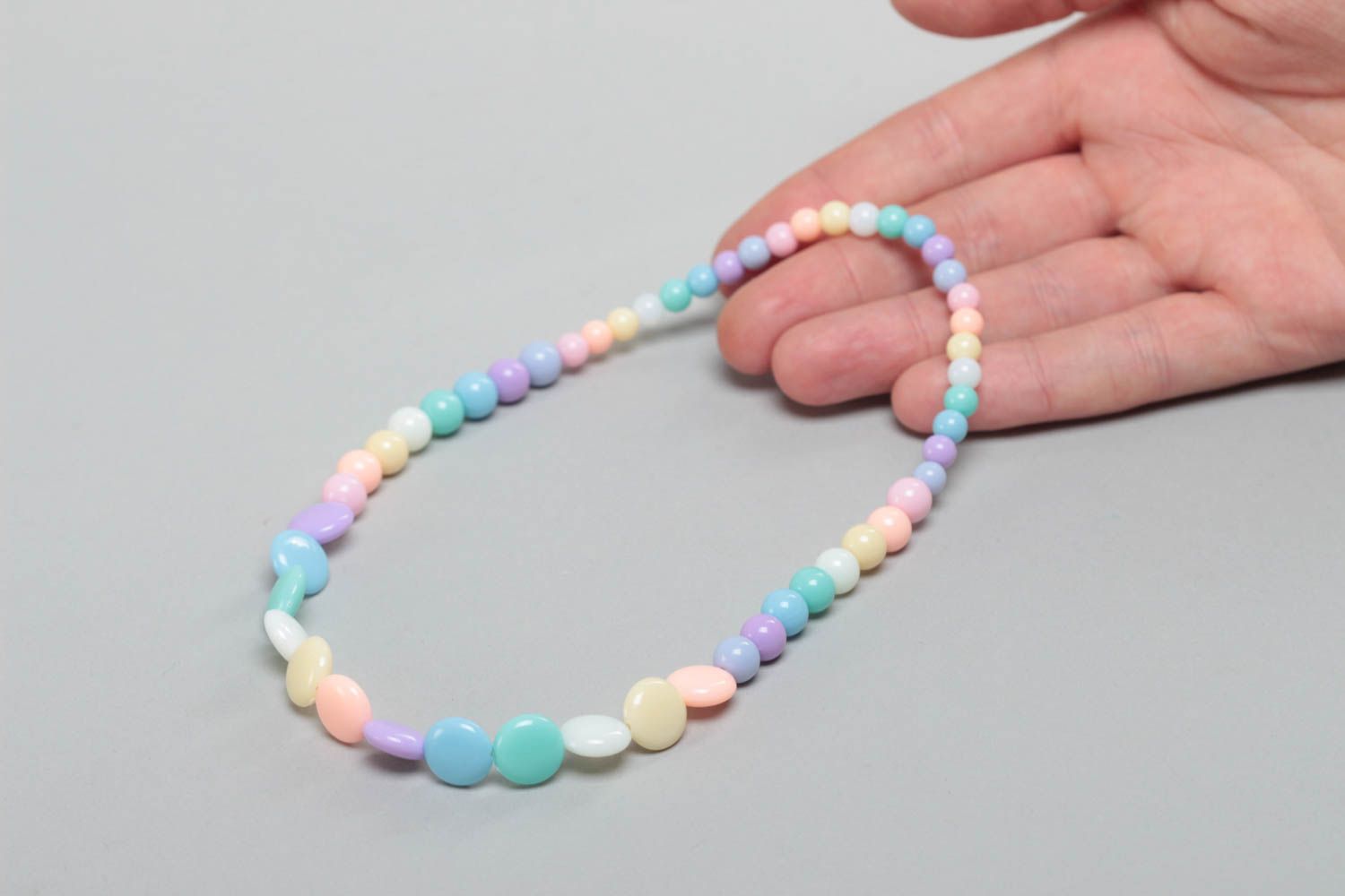 Handmade designer long children's plastic bead necklace of pastel colors photo 5