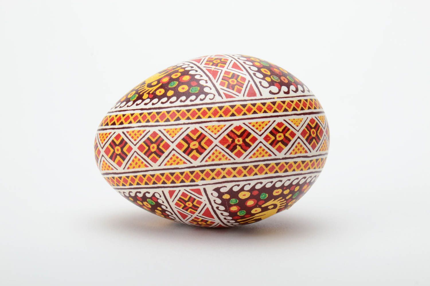 Handmade Easter egg painted with aniline dyes using waxing technique photo 3