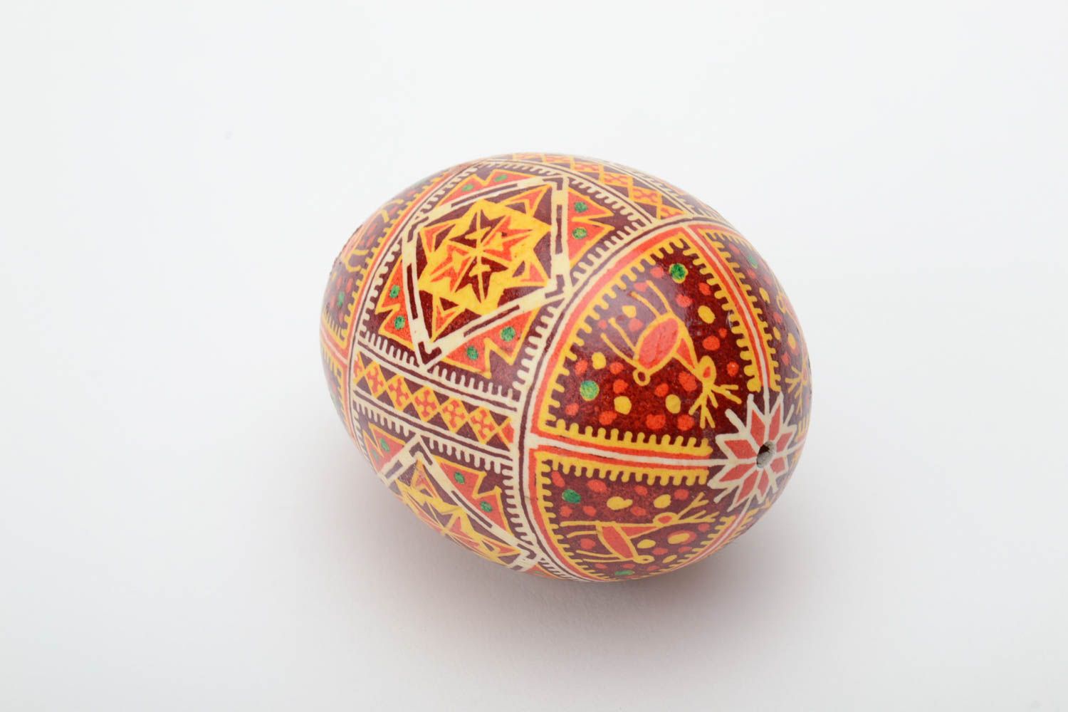Homemade decorative souvenir Easter egg painted with hot wax and aniline dyes photo 2