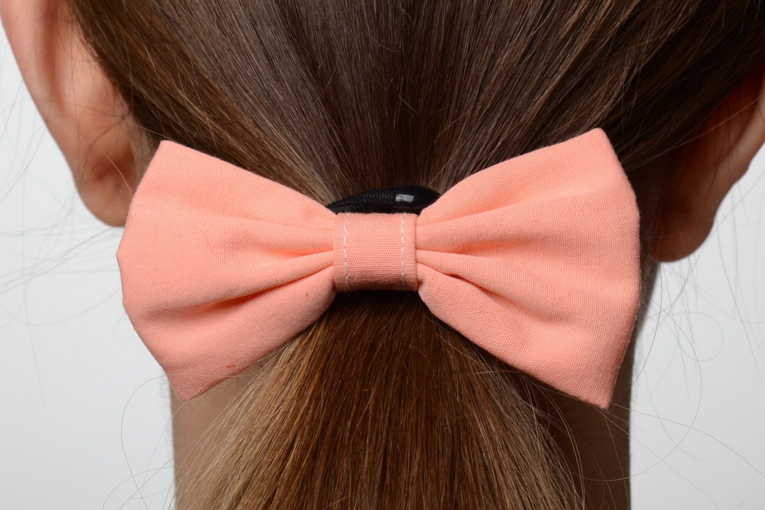 Handmade small women's cotton fabric bow hair tie of peach color photo 1