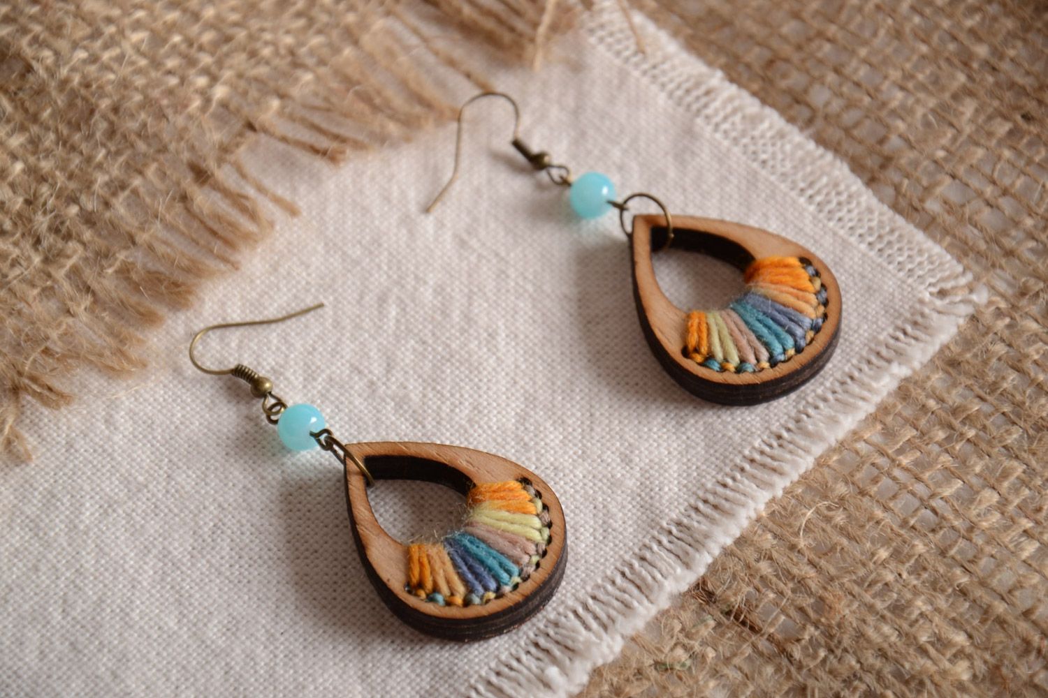 Handmade plywood earrings with colored thread embroidery in the form of droplets photo 1