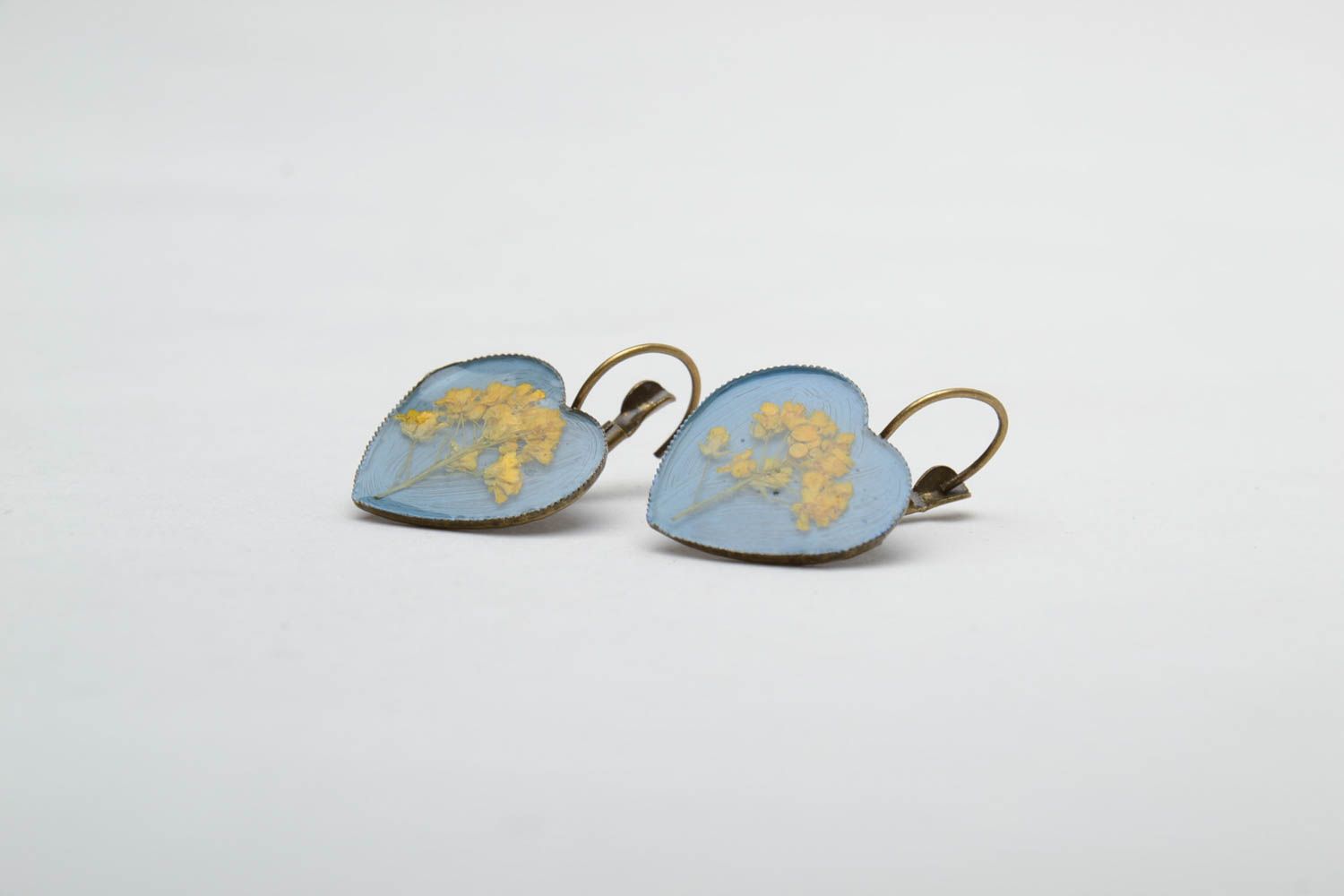 Heart-shaped earrings with natural flowers in epoxy resin photo 4