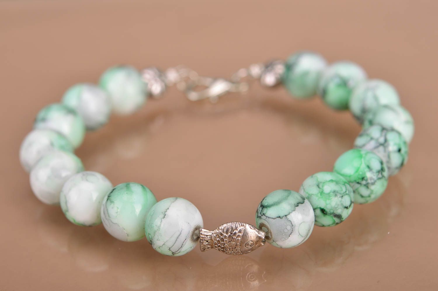 Handmade designer beaded green wrist bracelet with metal fish insert for women photo 2