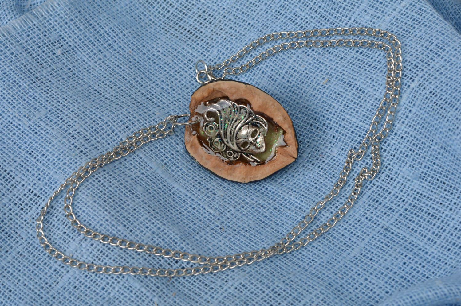 Handmade cute luminous pendant made of nut with metal mask of stranger photo 1