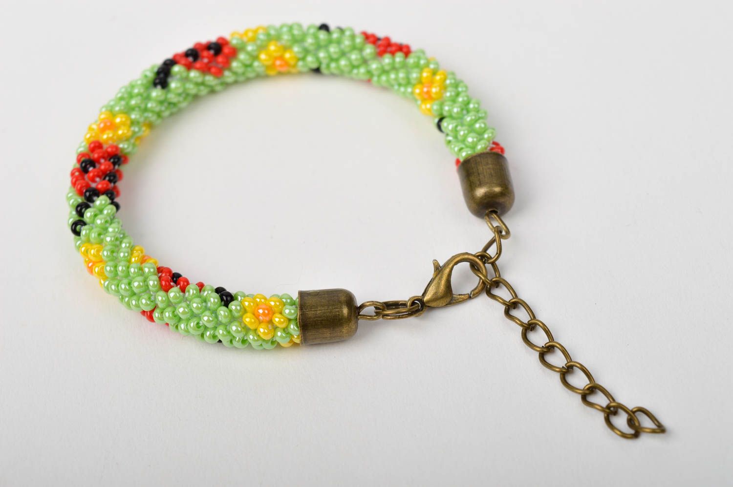 Handmade beaded cord adjustable bracelet in light green, red and black color photo 5