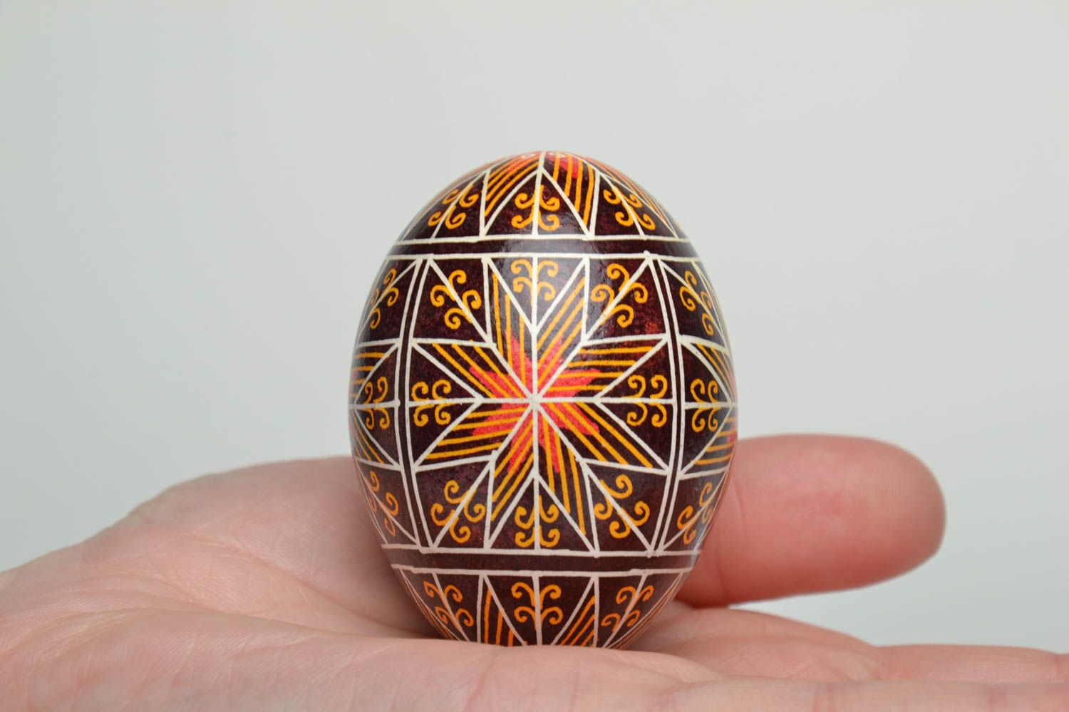 Handmade decorative Easter egg painted using waxing technique photo 5