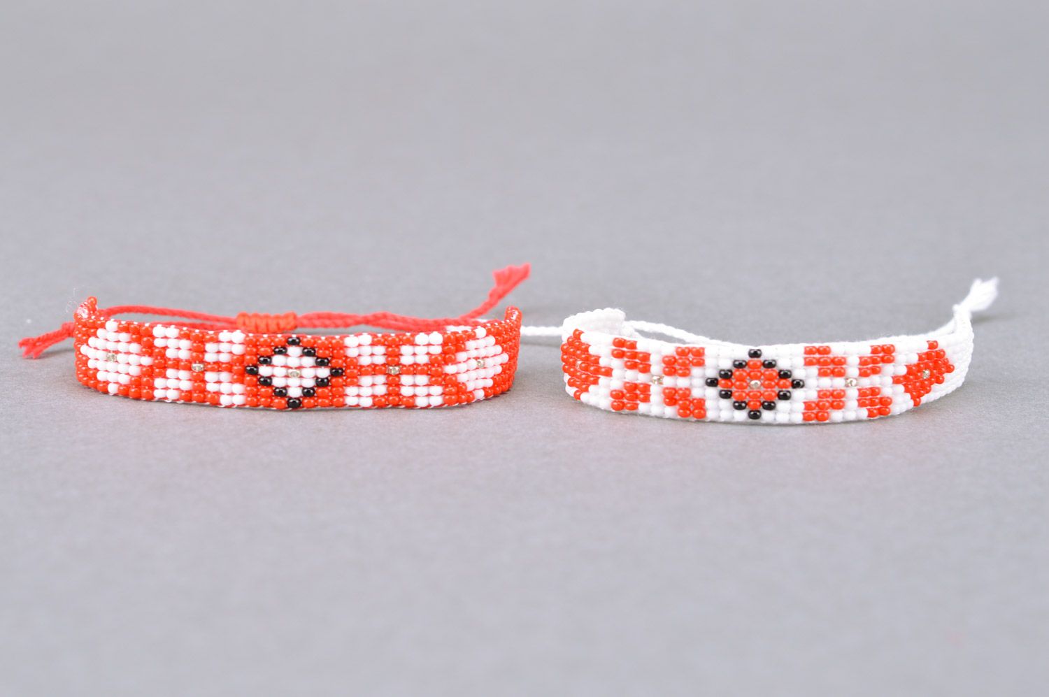 Set of 2 handmade white and red beaded ornamented bracelets with ties for women photo 2
