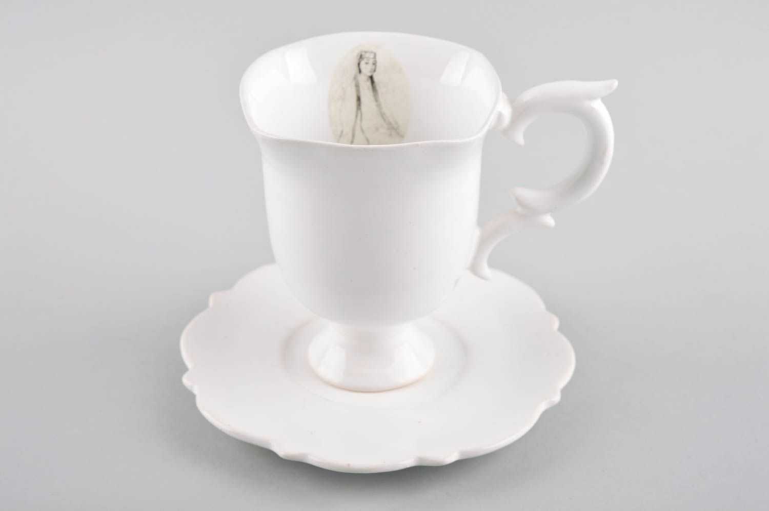 Super elegant white porcelain teacup with handle and saucer photo 1