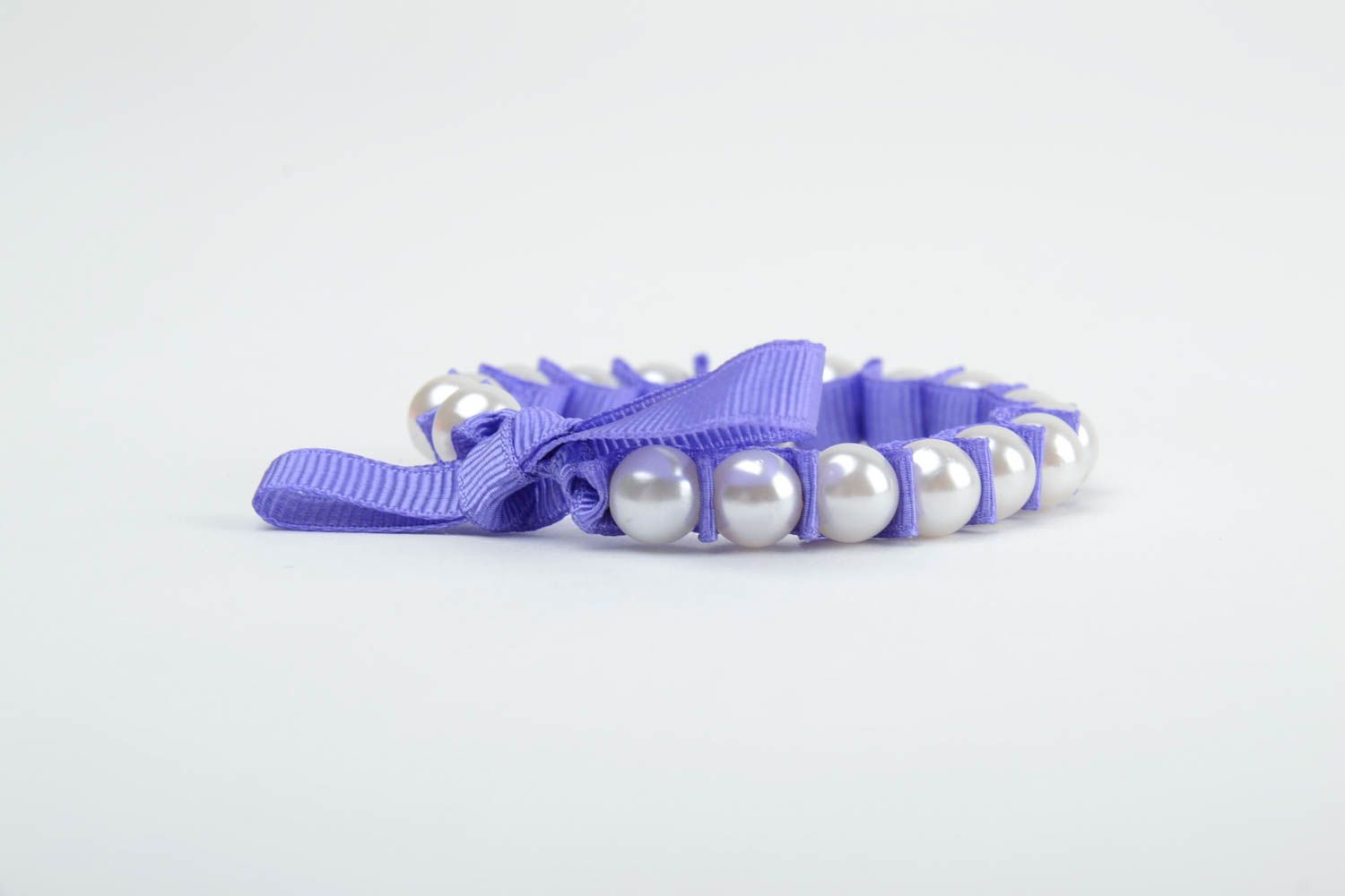Handmade thin wrist bracelet with plastic pearl like beads and violet rep ribbon photo 3