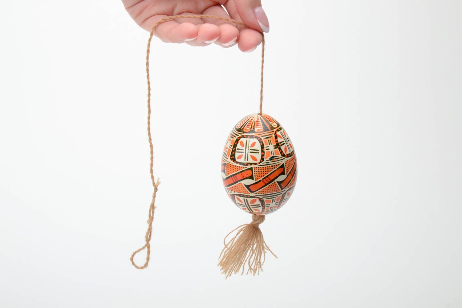 Handmade decorative Easter egg painted in brown color palette with beige tassel photo 5