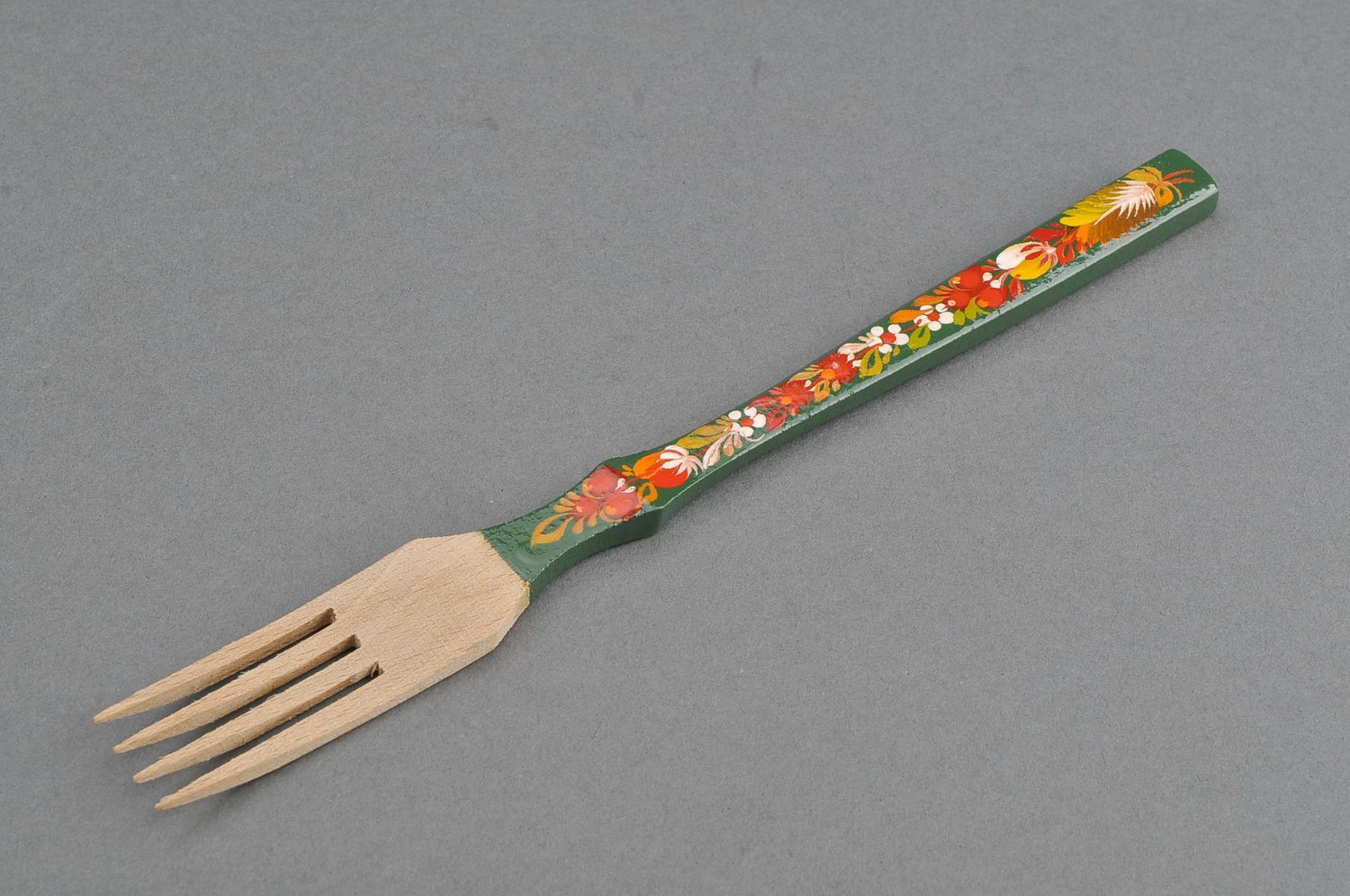 Wooden fork with green handle photo 1