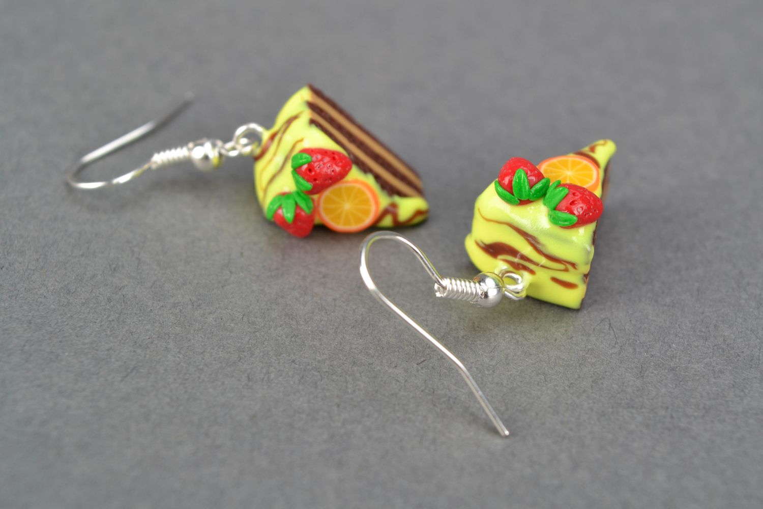 Polymer clay earrings with charms in the shape of orange cake pieces photo 4