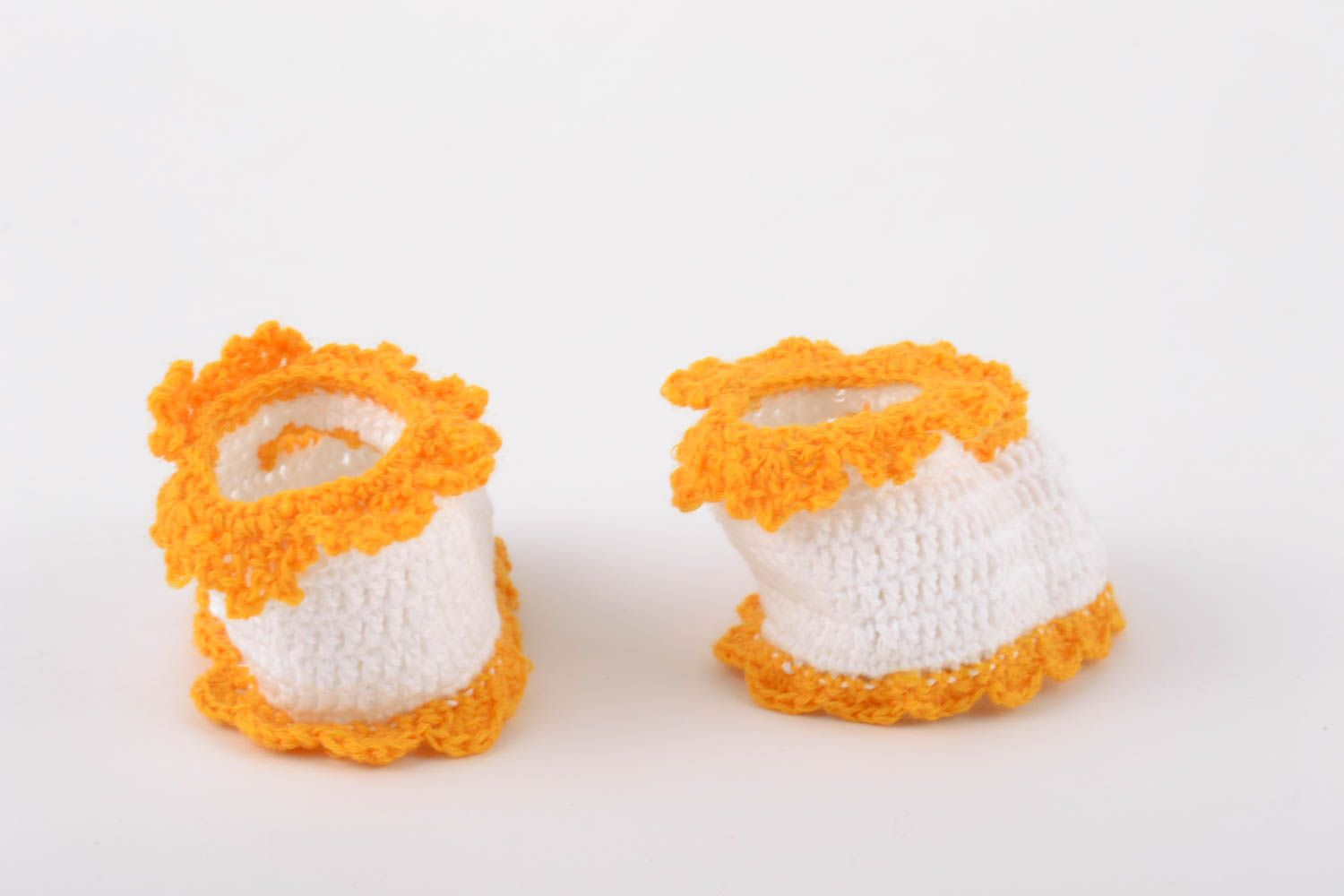 Handmade baby booties crocheted of natural white and orange cotton threads photo 5