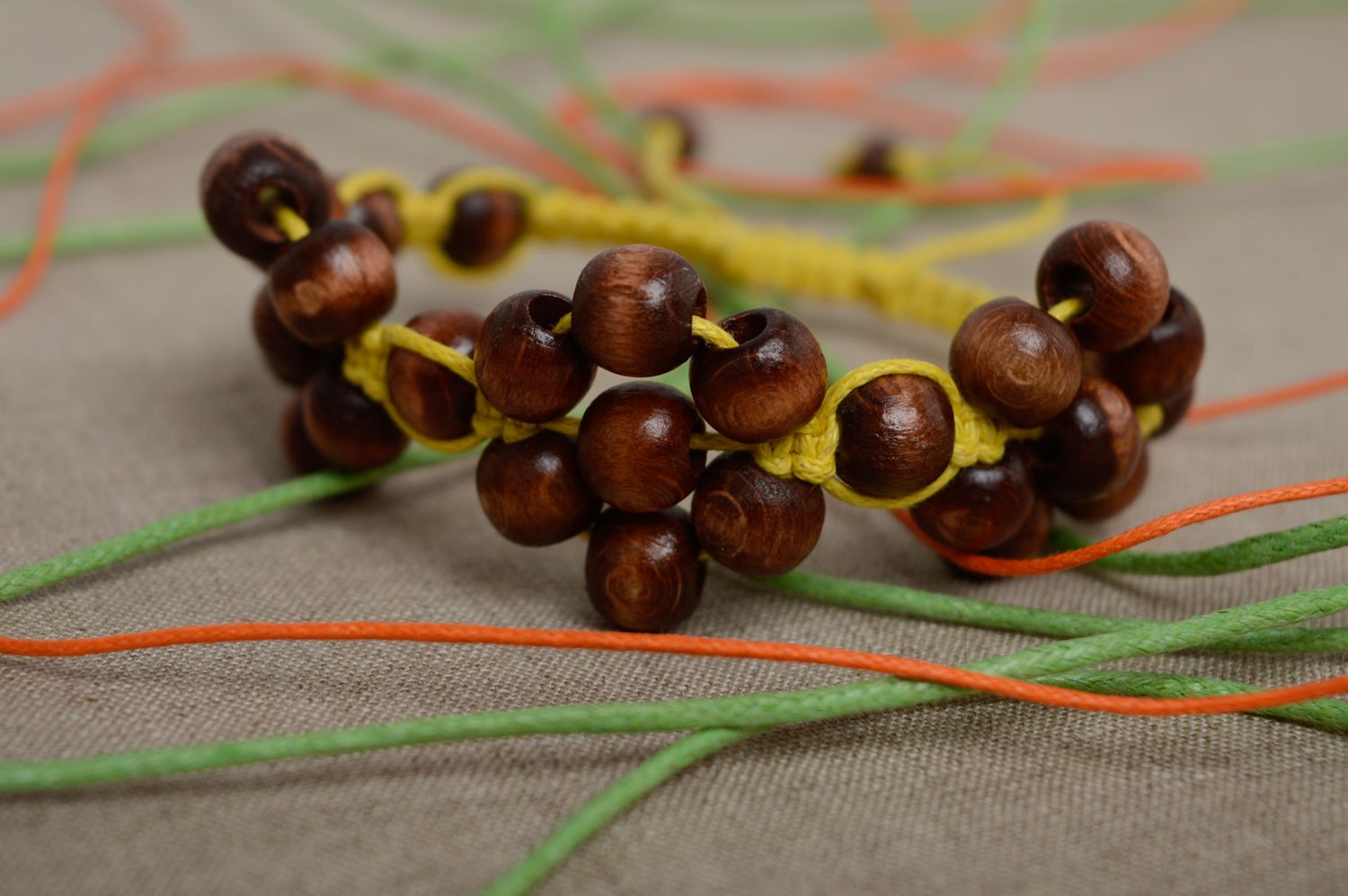 Macrame cord bracelet with wooden beads photo 2