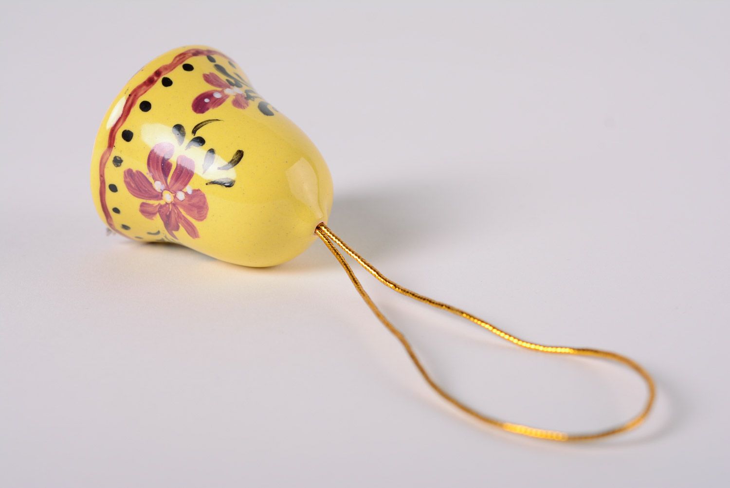 Handmade decorative yellow glaze maiolica ceramic bell with floral painting photo 5