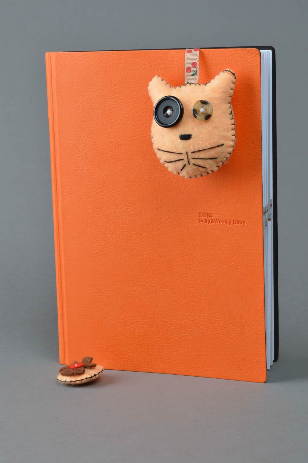 Beautiful designer handmade fabric soft bookmark toy cat of peach color photo 2