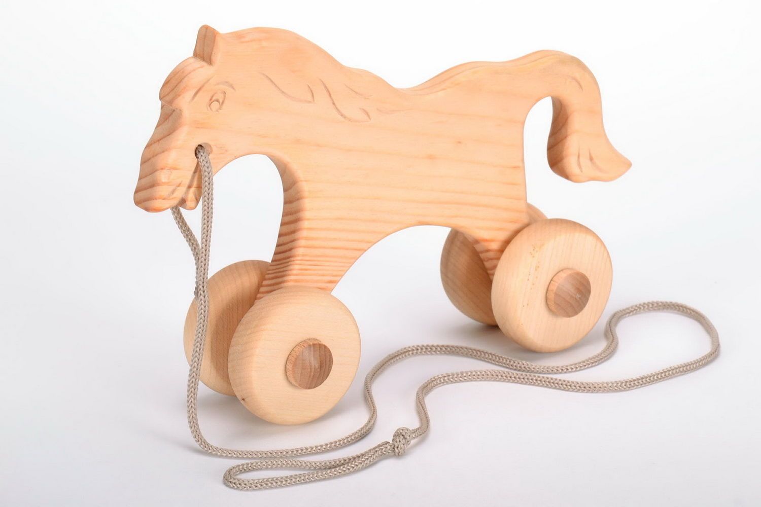 Каталка-лошадка деревянная фото 1