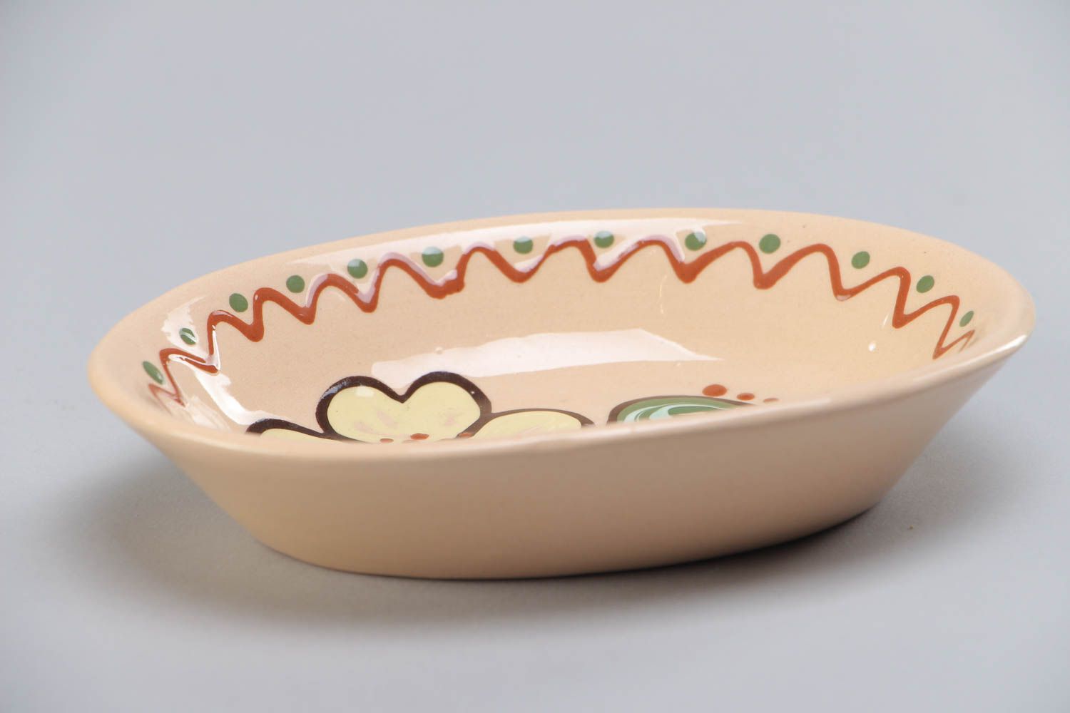 Handmade oblong ceramic bowl painted in ethnic style and coated with glaze photo 2