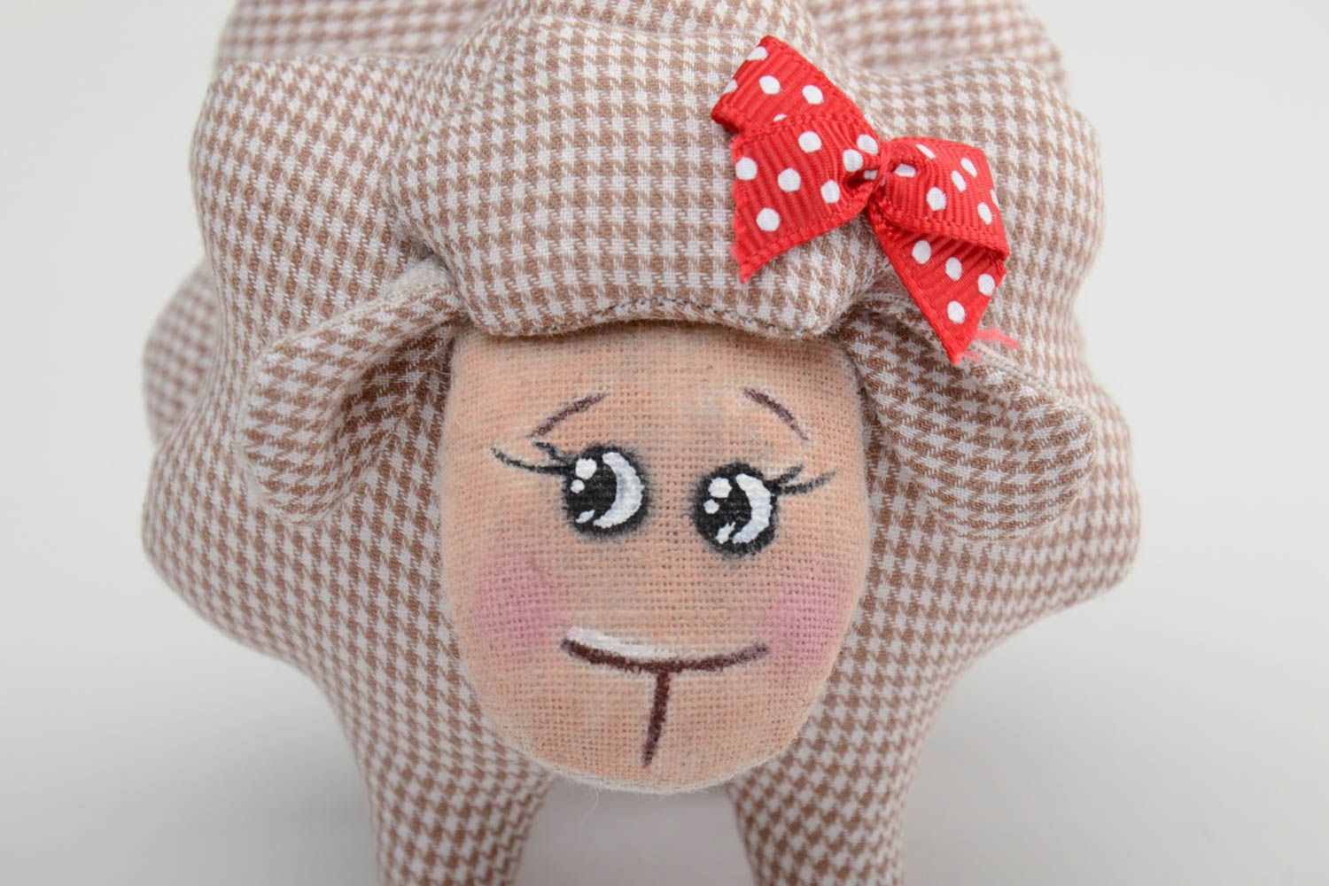 Handmade small soft toy sewn of checkered beige cotton fabric lamb with red bow photo 3