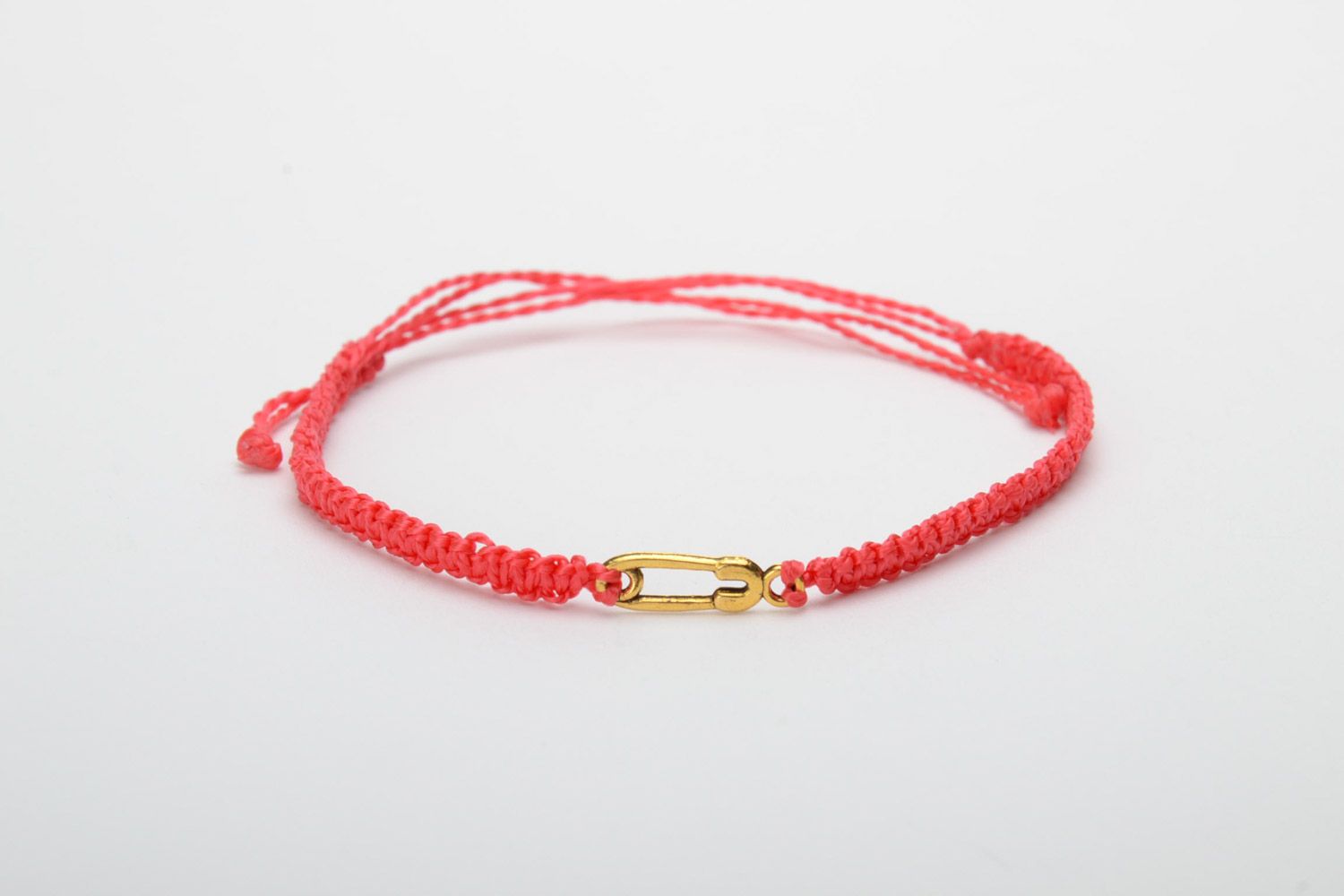 Handmade women's woven thread bracelet of red color with metal pin charm photo 5