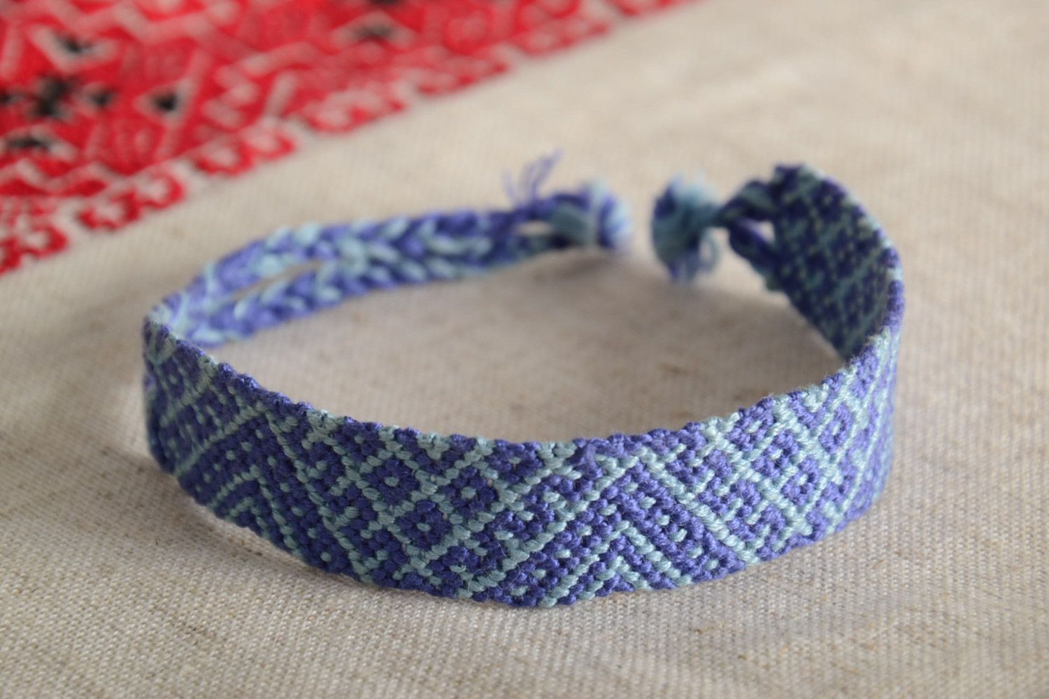 Handmade friendship wrist bracelet woven of threads in blue color with ties photo 1