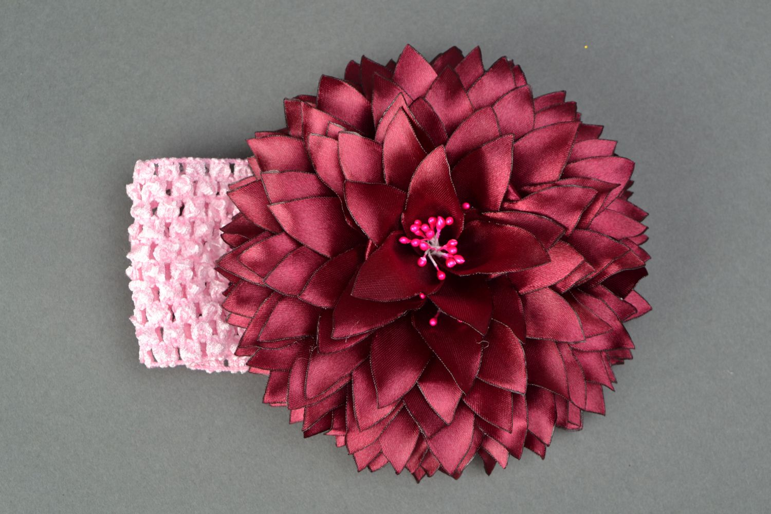 Rosa Haarband mit Blume foto 1
