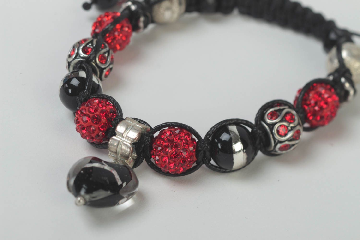 Black rope cord strand bracelet with black, red beads and heart-shaped charm photo 4